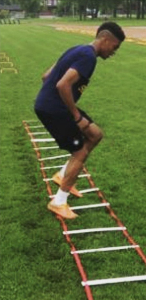 The Pathwai founder doing ladder drills on a grass field