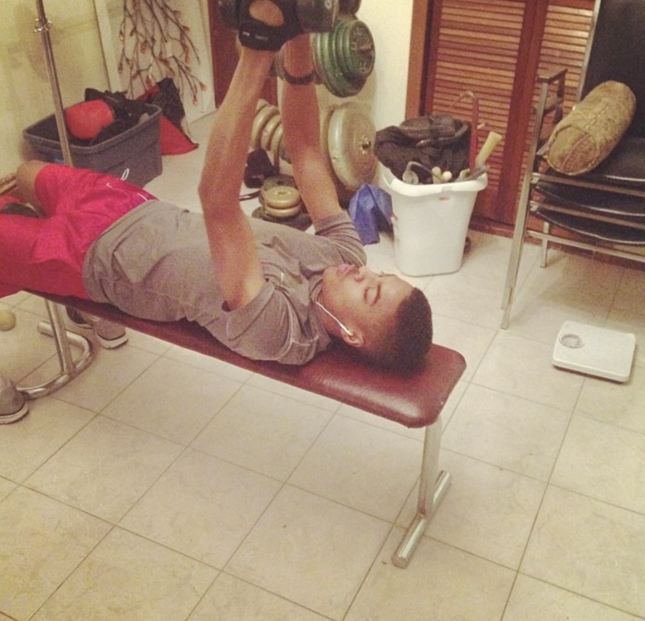 The Pathwai founder lifting dumbbells at home during his early training days
