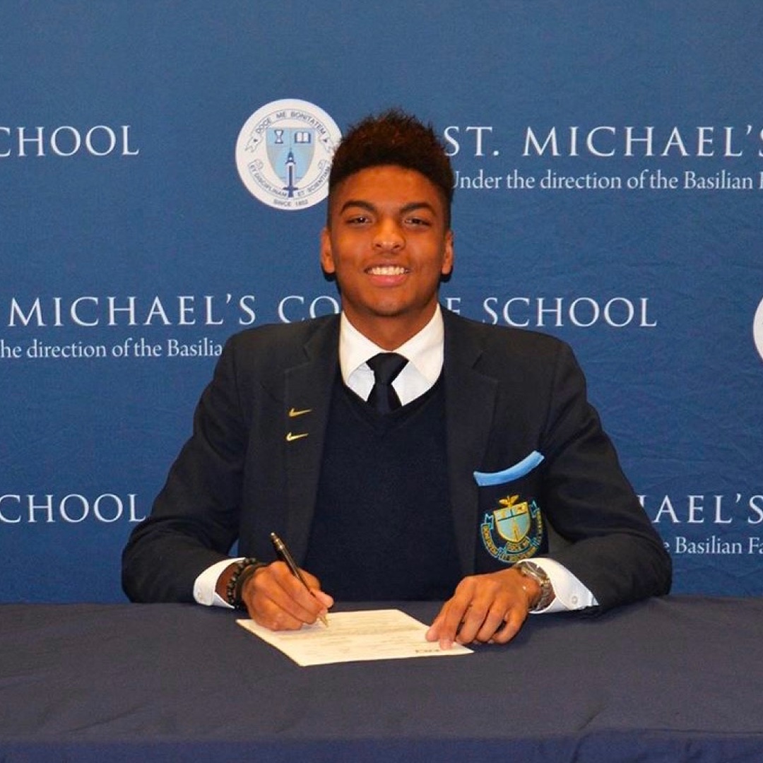 The Pathwai founder signing his full athletic scholarship with Holy Cross